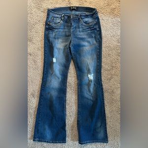 Distressed stretch denim jeans